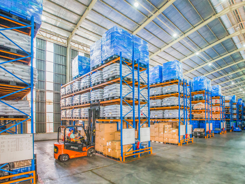 Large warehouse with towering shelves filled with stacked packages
