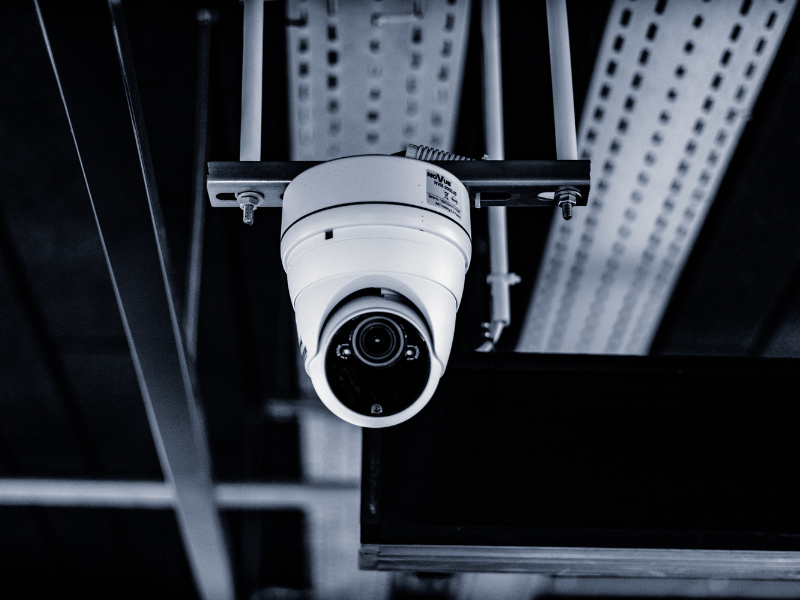 Close-up of a modern security camera installed in a warehouse