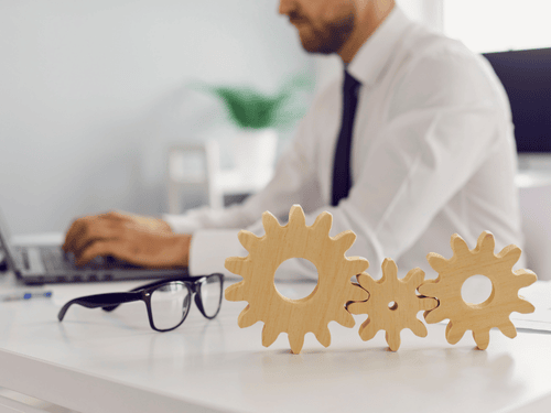 Businessman using digital tools symbolizing API integration for streamlined operations and backend workflow efficiency