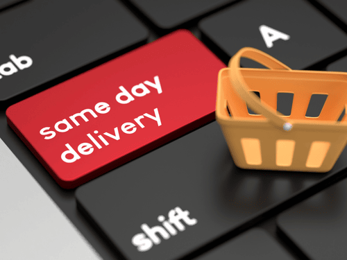 A red keyboard key marked "same day delivery" highlights fast and responsive fulfillment solutions