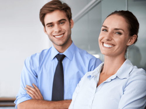 Smiling professionals provide expert VMI client support and inventory consultation in a business office setting